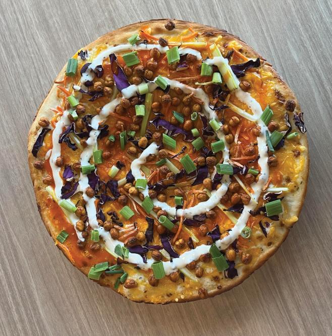 The buffalo roasted chickpea flatbread from The Queen of Squash is a Peoria local favorite.