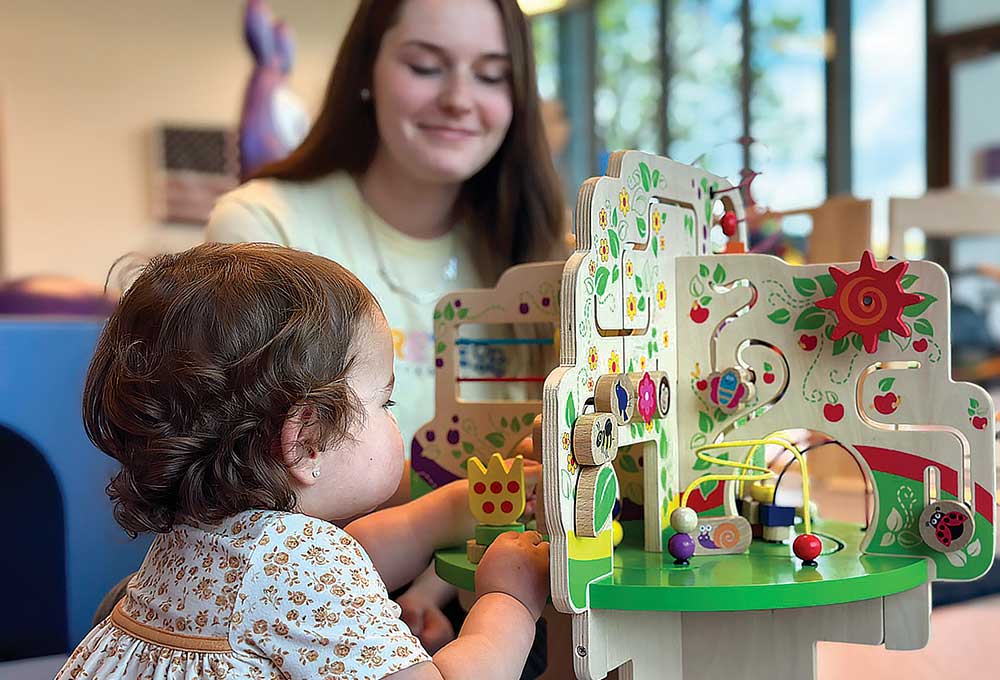 Child plays with toys at SRM Concrete Christian Academy.