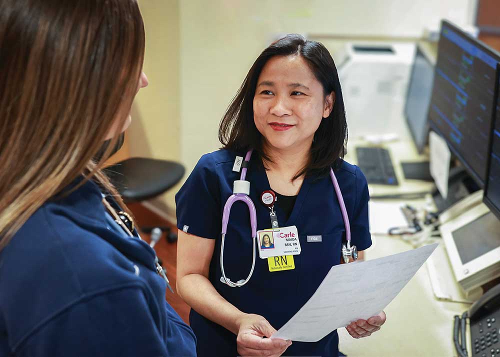 Nurse assists patient. 