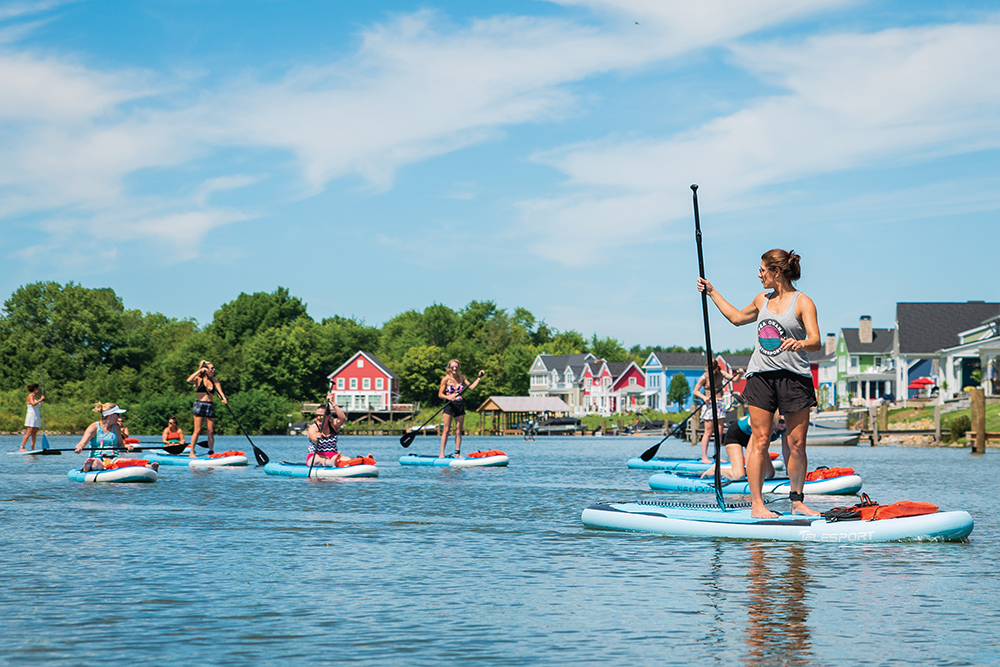 People paddle board on Buckeye Lake in Licking County, Ohio.