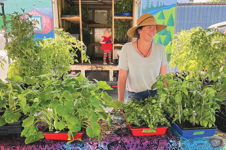 Local vendor sells a variety of different plants at the Independence Farmers Market.