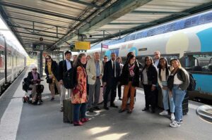 September 2022 Our delegation arrives in Caen, France, by train for the annual legal exchange. Host families and long-time participants of the relationship were waiting at the station to greet the group and welcome them to Caen