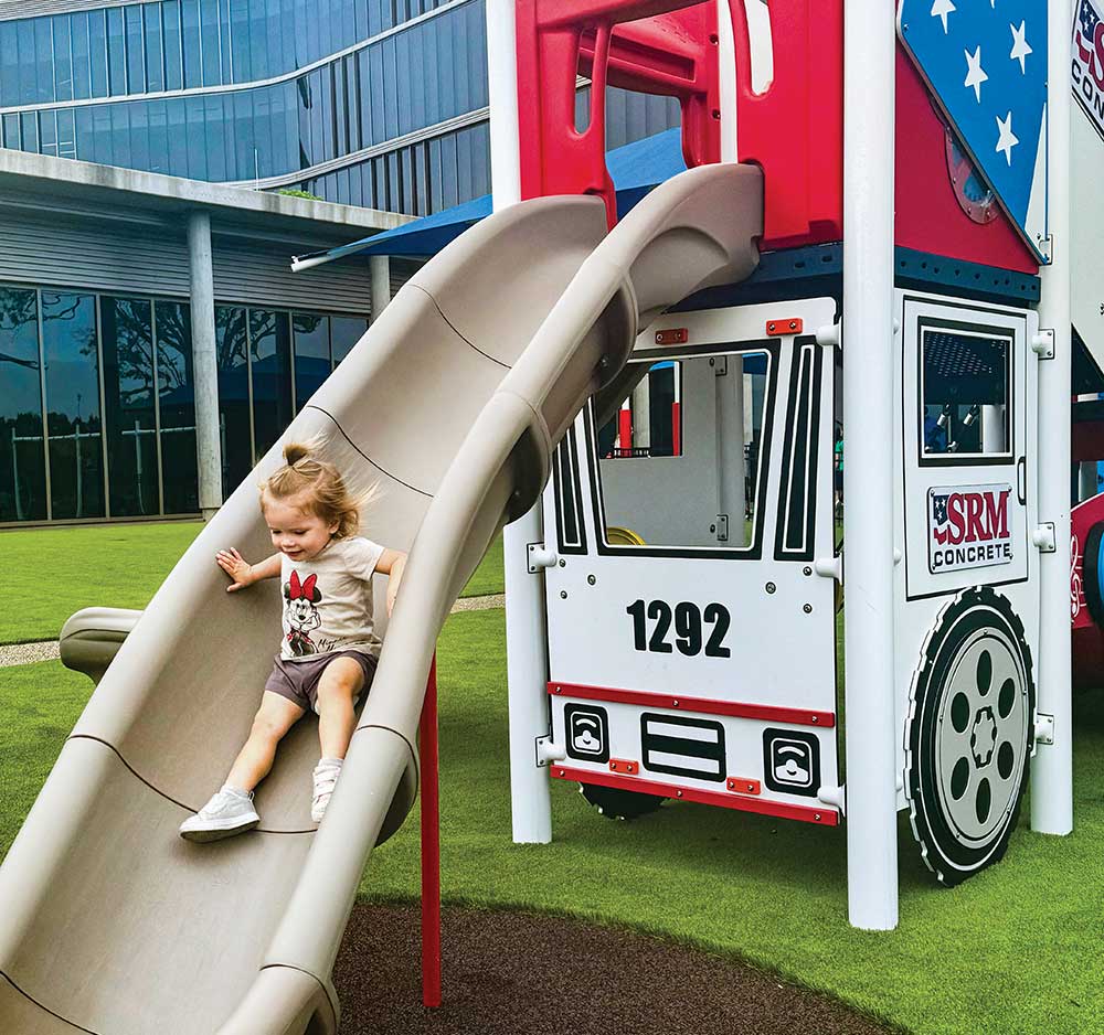 Child goes down the slide at SRM Concrete Christian Academy.