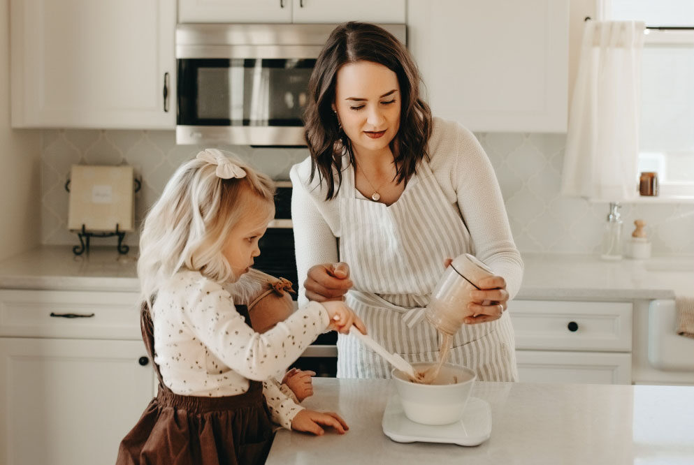 Mother and daughter cooking together