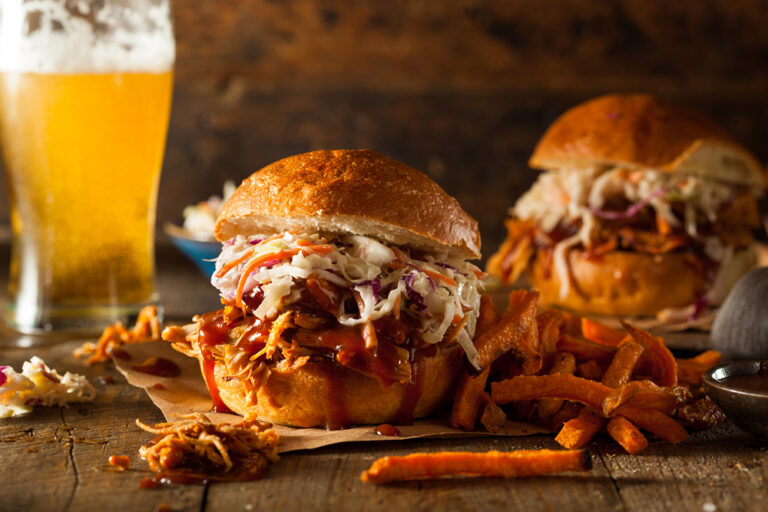 Homemade Pulled Chicken Barbecue Sandwich with Coleslaw and Fries. There are many great restaurants in Greenville NC to try.