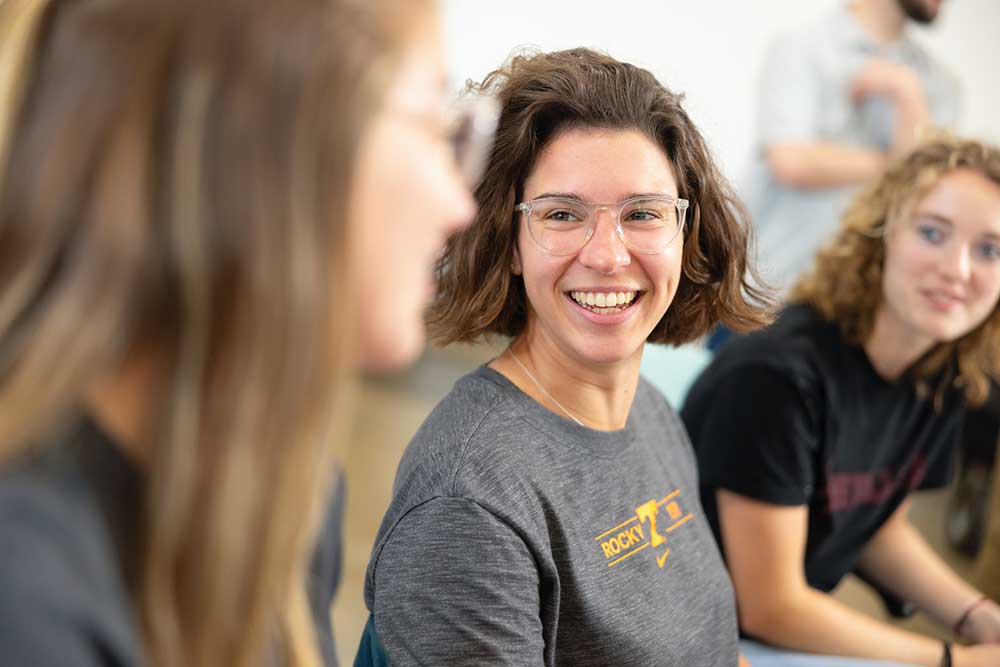 Lady Vol swimmer Margaret Marando, a landscape architecture major, works with friends inside a computer lab in the Art and Architecture Building on August 29, 2023. Photo by Steven Bridges/University of Tennessee.