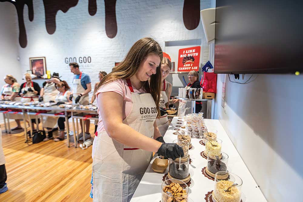 Sarah Casey chooses her ingredients during a build your own Goo Goo at Goo Goo Chocolate in downtown Nashville, August 2023.