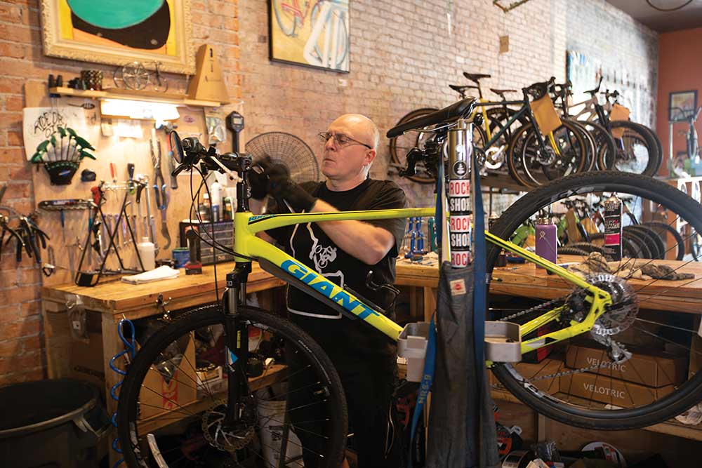Mike McAuley repairs a bike at Bull Moose Bicycles in Twin Falls.