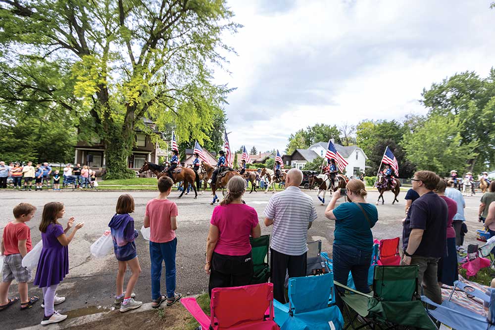 Members of the American Glory Flag Team Color Guard lead the parade to open the Lincoln County Fair and Rodeo in Shoshone, Idaho.