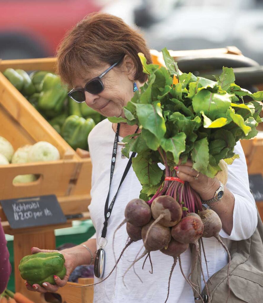 Visitors shop for produce at Rain or Shine Farm at Twin Falls Farmer's Market which happens on Saturdays on Pole Line Road in Twin Falls, Idaho.