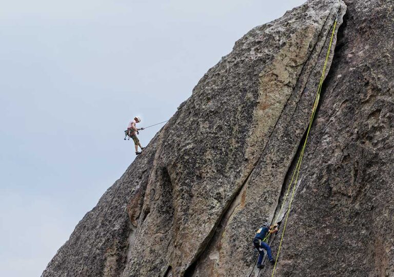 Rock Climbers scale the face of Elephant Rock at City of Rocks near Almo, Idaho.
