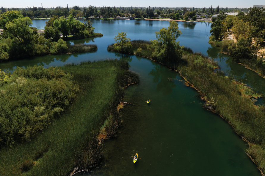 Kayakers paddle in the Lodi Lake Wilderness Area in Lodi, California. 
