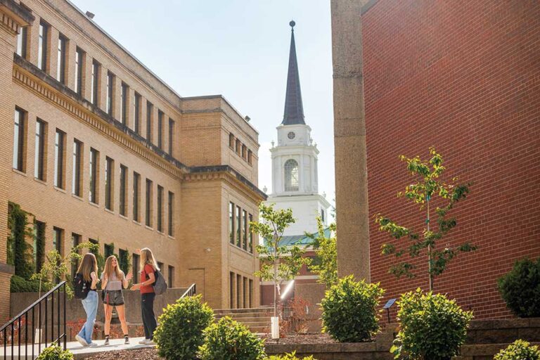 Students chat on campus at Coe College in Cedar Rapids, IA.