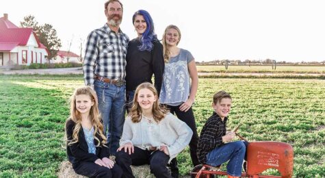 Family taking professional pictures at their home.