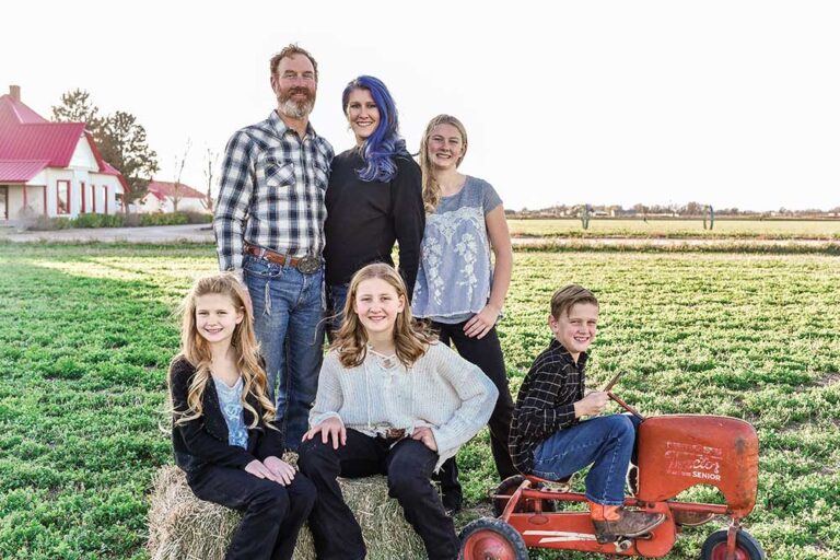 Family taking professional pictures at their home.