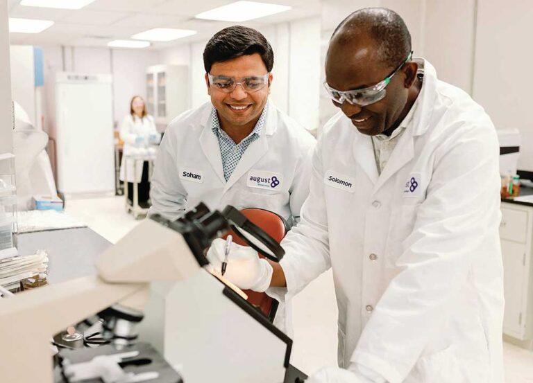 Scientists work at August Bioservices, a Nashville-based contract development and manufacturing organization (CDMO) focusing on sterile injectable medications.