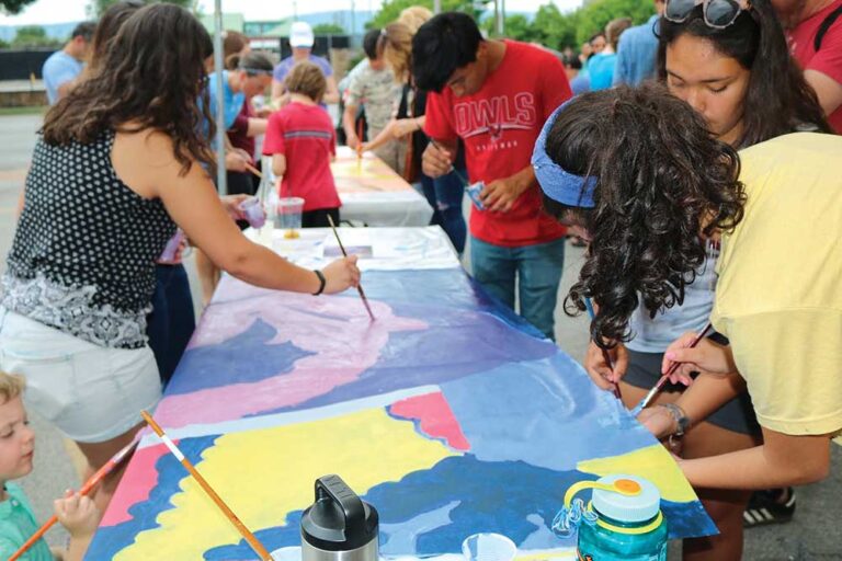 Over 120 community members including Mayor Berke came together to help paint the “Dreaming Forward/ Soñando” mural. Located on the corner of Broad and Main streets