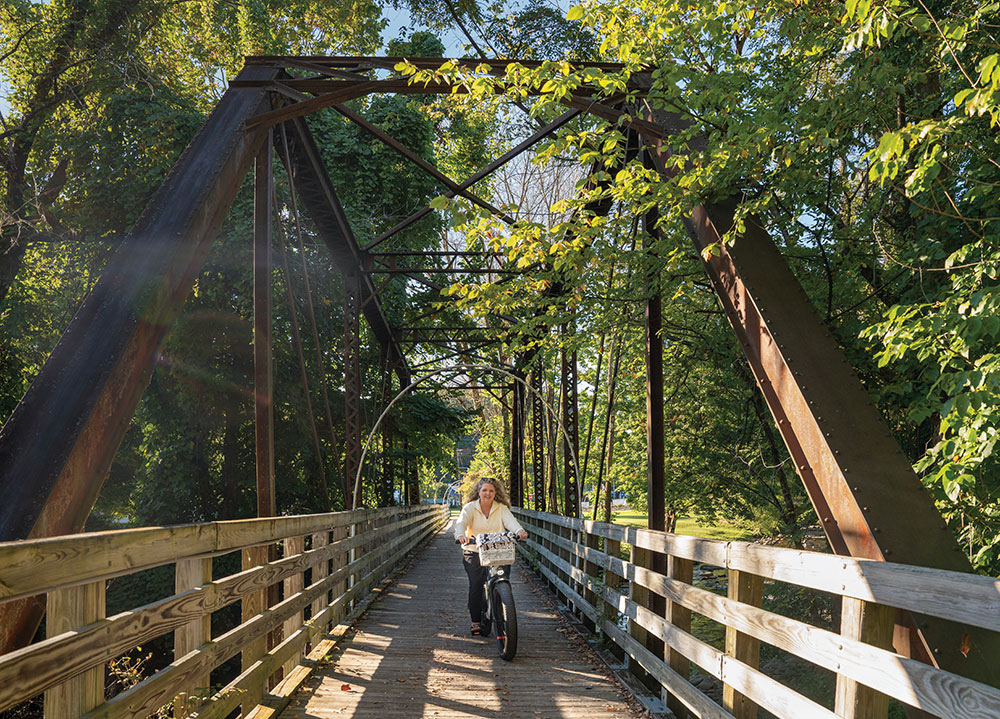 A cyclist rides along the Virginia Creeper Trail.