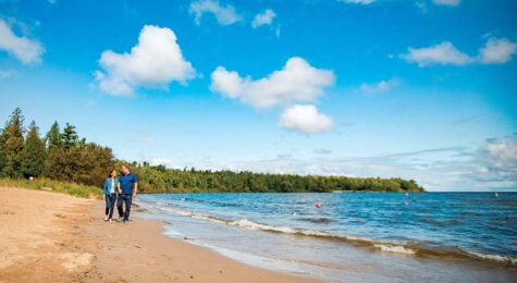 A couple walks along Lake Michigan at Peninsula State Park in Wisconsin.
