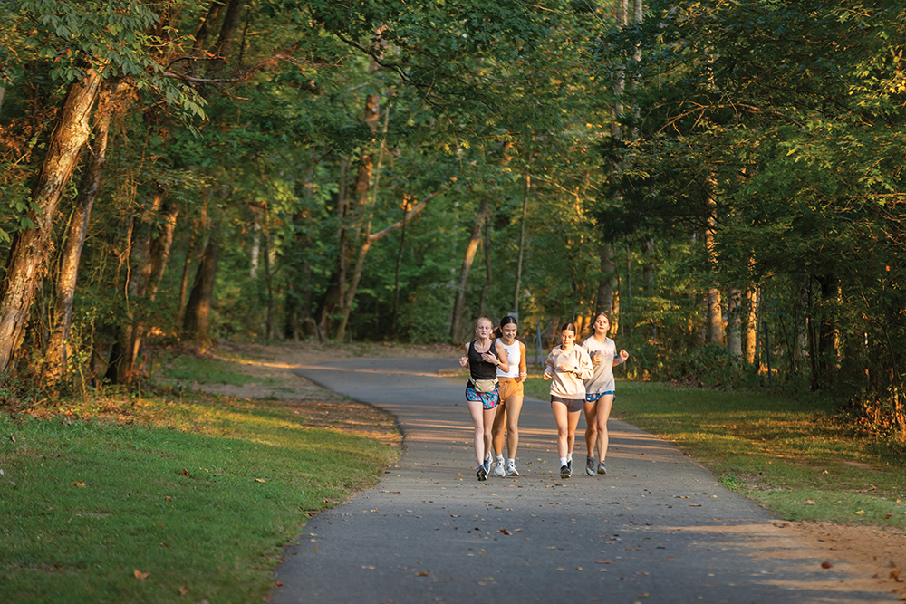 Young women run along the White House Greenway in White House, Tennessee.