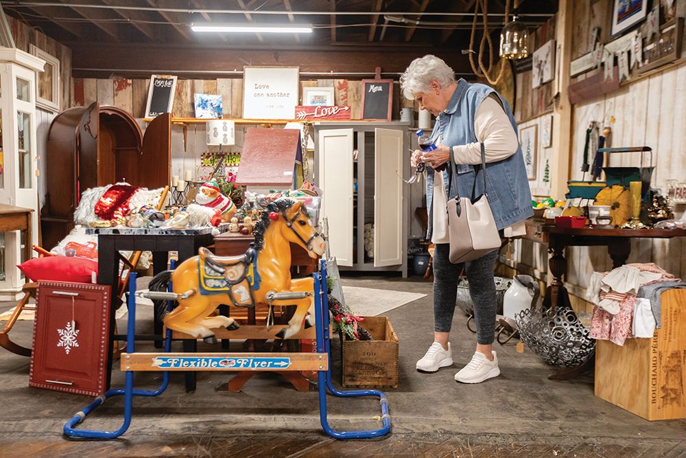 Betty Poole browses a booth at the Springfield Antique Barn in downtown Springfield, TN.