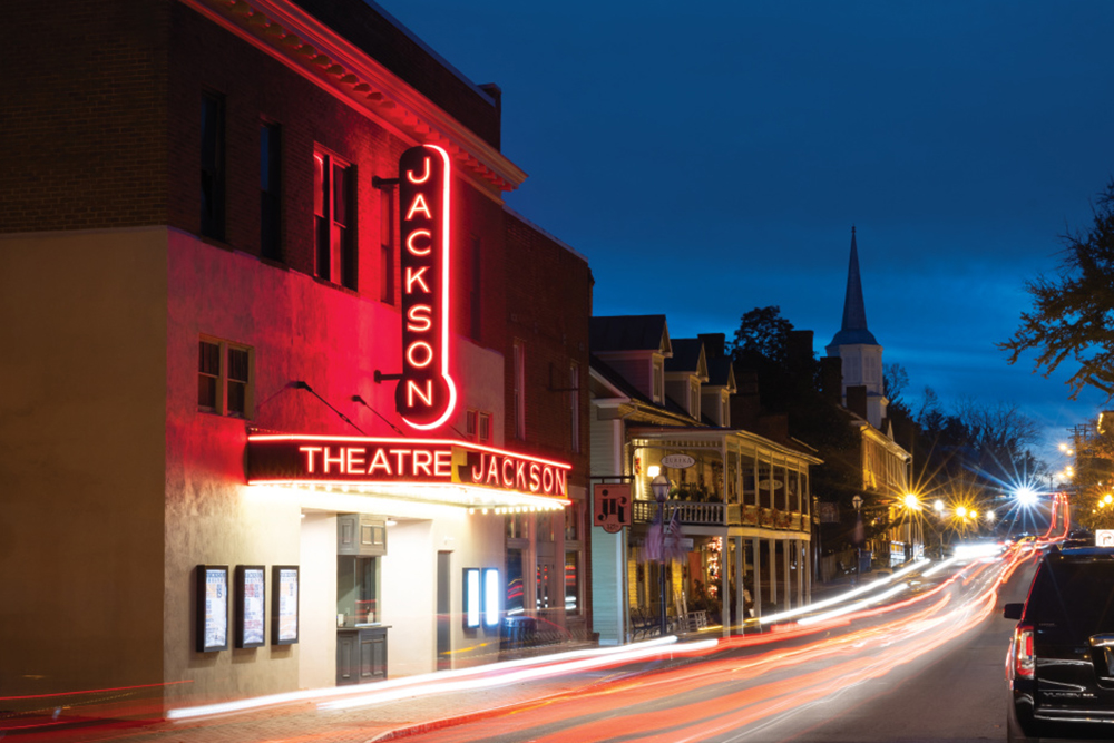 The recently renovated Jackson Theatre marquee lights up at dusk in downtown Jonesborough, Tennessee.
