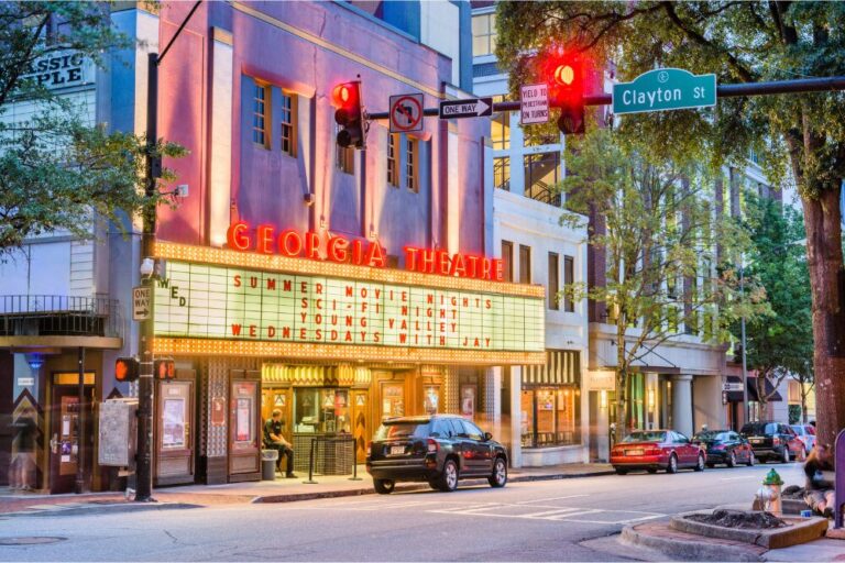 People visit the historic Georgia Theatre at dusk. The venue has featured many prominent acts from the prolific Athens music scene.