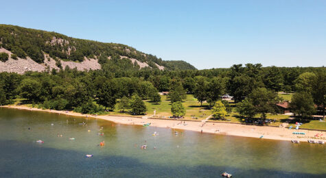 Visitors swim and relax at the beach area at Devil's Lake State Park near Madison, WI.