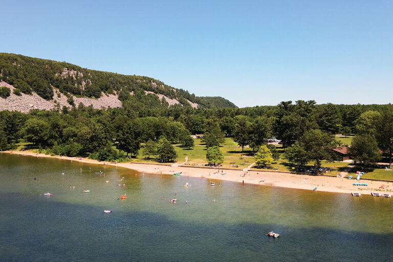 Visitors swim and relax at the beach area at Devil's Lake State Park near Madison, WI.