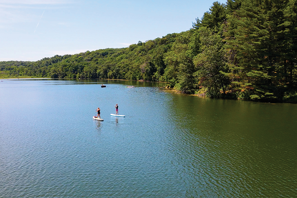 People paddle board on the lake at Governor Dodge State Park in Iowa County, WI.