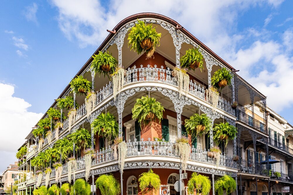 Old french building with typical iron balconies in the french quarter in New Orleans, Louisiana stock photo
