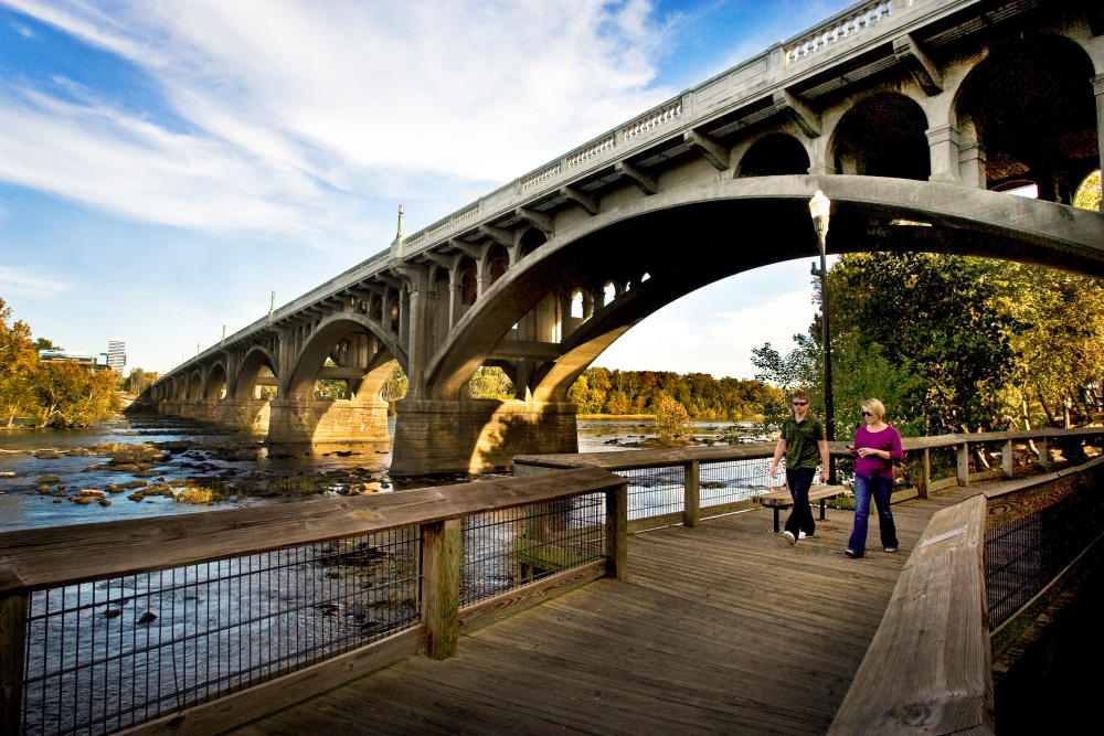 A couple walks along the Congaree River in Columbia, SC, one of the best places to live in the U.S.