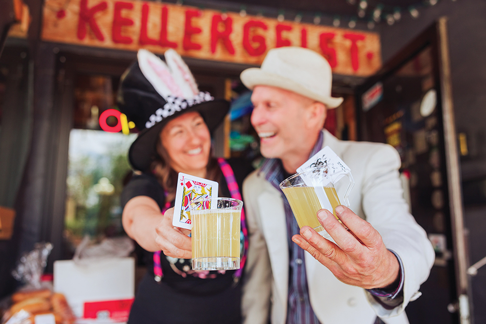 A couple makes a toast with their craft mimosas at the Mimosa Showdown in downtown Green Falls, MT.