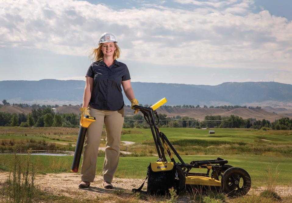 Ily Nunn, owner of Nunn Utility Locating, poses with some of the equipment she uses to locate underground utilities.