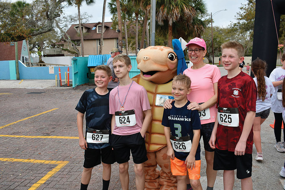 Boys participate in a fun run to support Volusia Turtle Patrol.