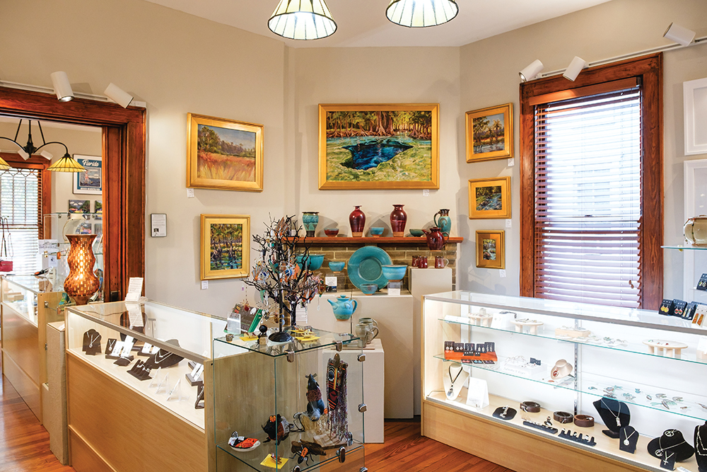 Art, pottery and jewelry are displayed for sale at Artisan's Guild Gallery in Gainesville, FL.