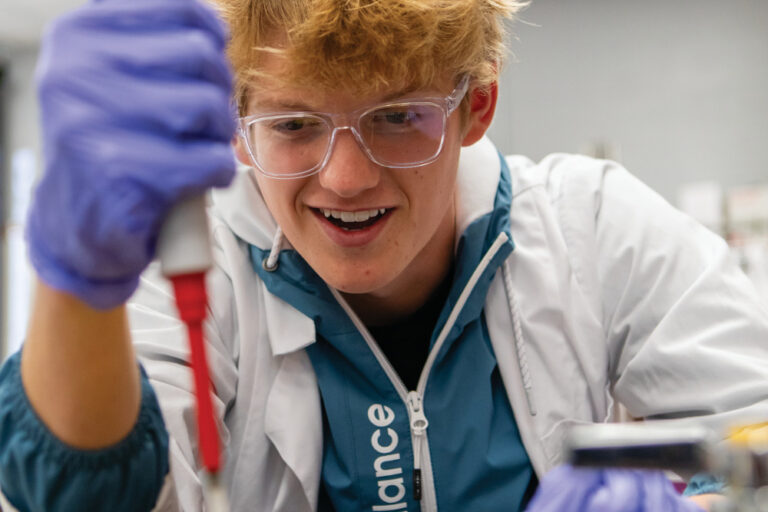 Biology student Jackman Brinley uses a pipette to move a liquid sample during a that is part of White House Heritage High Schoolís Career and Technical Education program.
