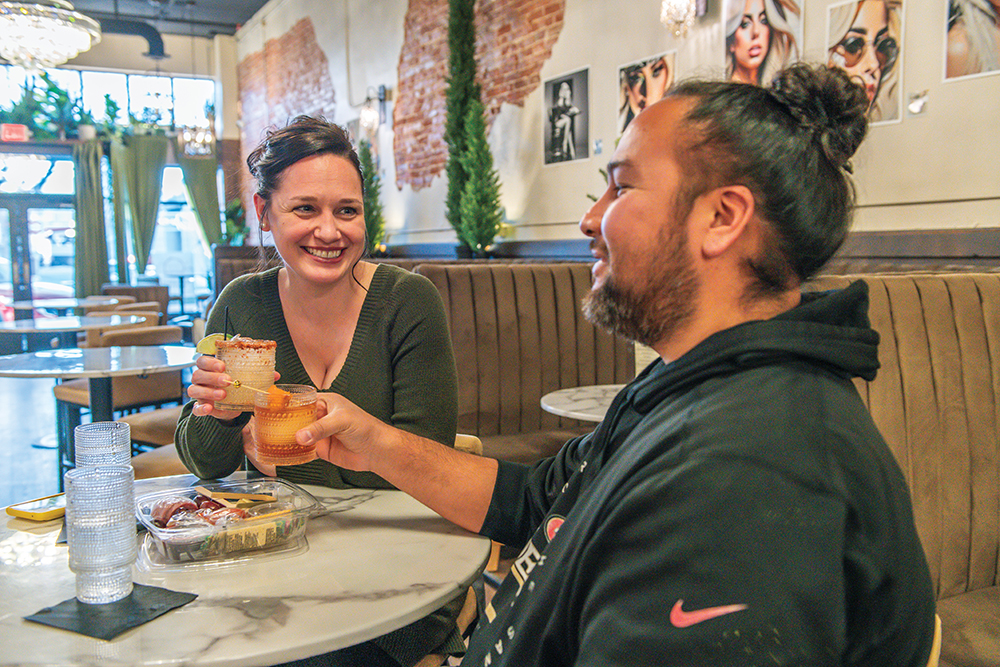A couple enjoys cocktails and snacks at The Syringa Cocktails & Coffee in Nampa, ID.