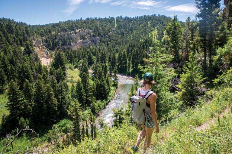 woman hiking at Sluice Boxes State Park in Montana