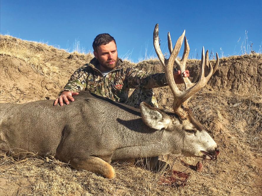 A hunter with a deer