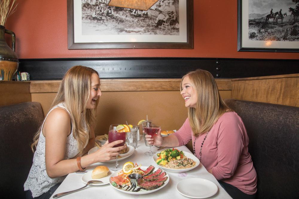 Two customers eat at Firerock Steakhouse