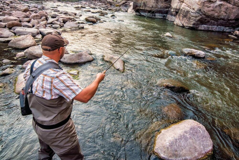 Fly fisherman in Fremont Canyon, Wyoming