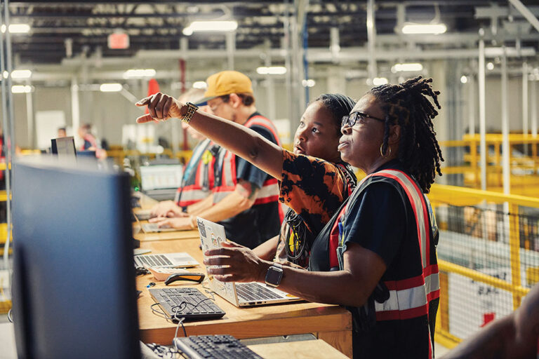 Employees work at the Amazon fullfillment center in Nampa, ID.