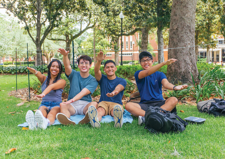Florida students do the popular Gator chomp cheer.