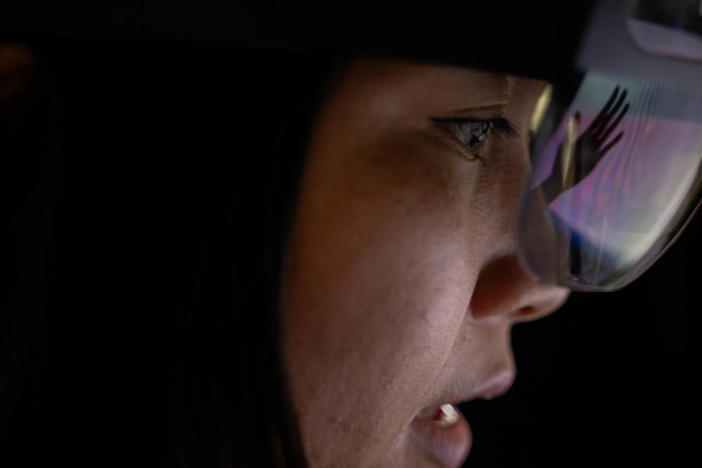 Girl looks through microscope