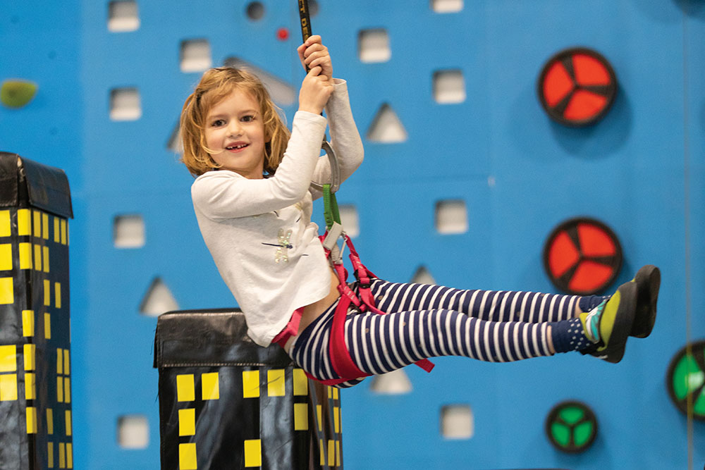 Leigh McCain, 7, rapells down after climing a wall in the Kids Climb area at Climb Murfreesboro in Murfreesboro, Tennessee.