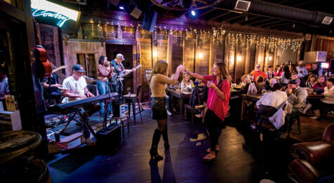 Visitors dance to the music of Mindy Ellis Campbell and her band at the Grindstone Cowboy in Eagleville, Tennessee.