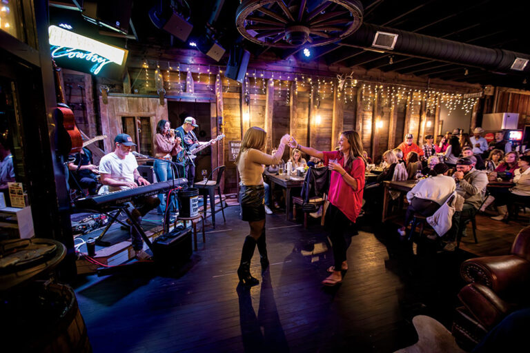 Visitors dance to the music of Mindy Ellis Campbell and her band at the Grindstone Cowboy in Eagleville, Tennessee.