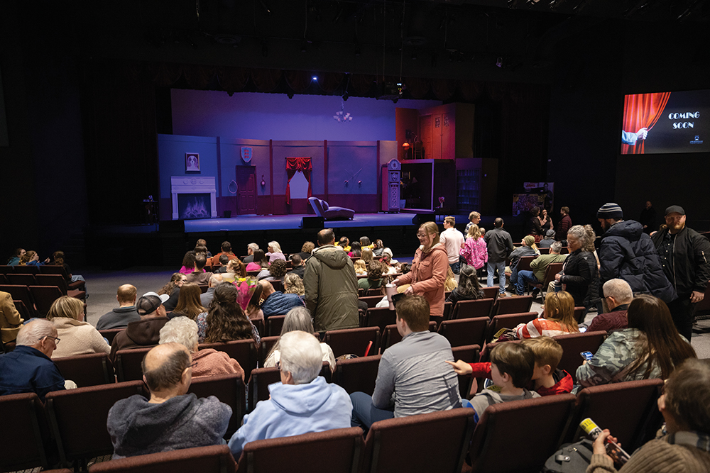 People find their seats inside the Springhouse Theatre in Smyrna, TN, for a performance of "The Play That Goes Wrong."