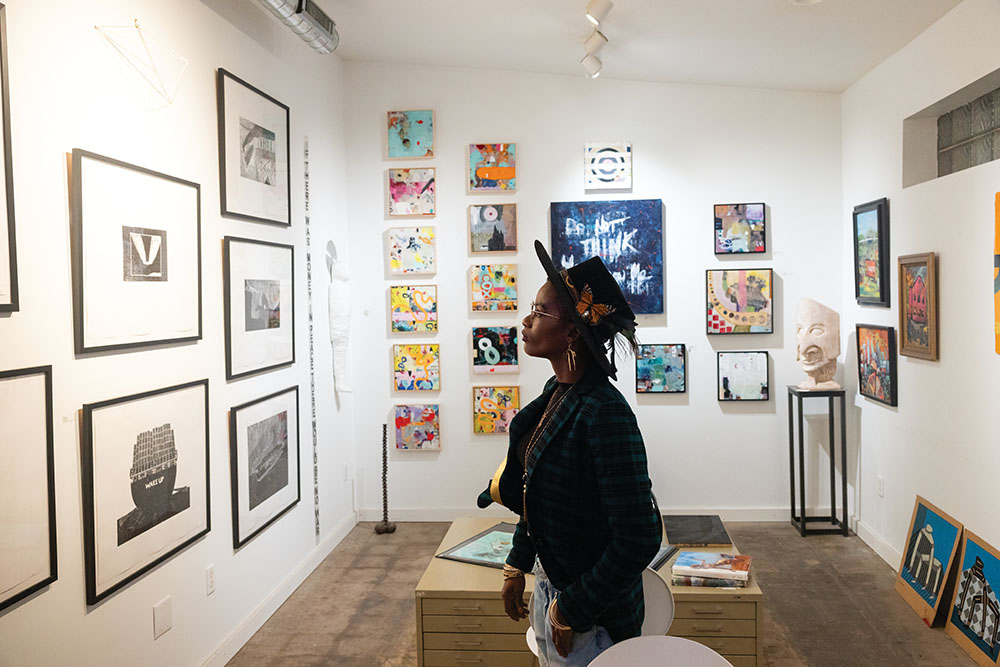 Visitors view art work on display at Blo Back Gallery during the First Friday Art Walk in downtown Pueblo, CO.